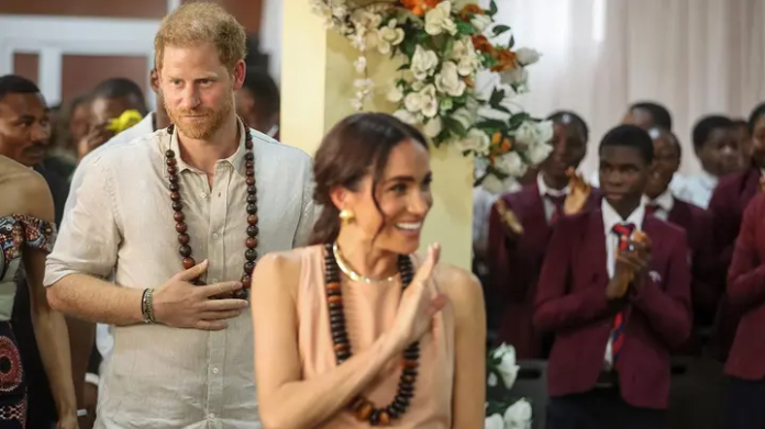 Meghan Markle Sparks Controversy During Nigeria Trip By Wearing Dress Called 'Windsor' - SurgeZirc